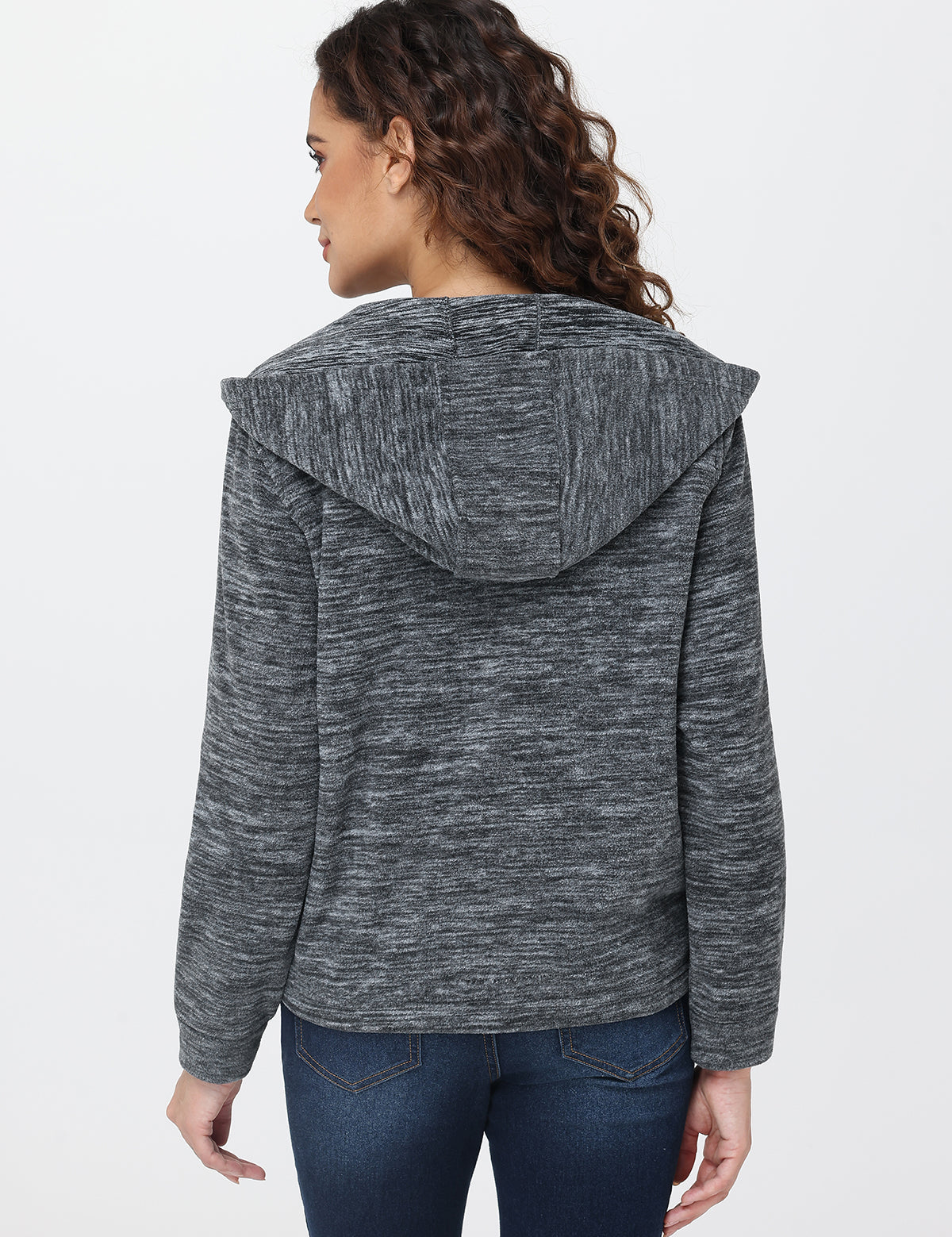 Person wearing a gray hooded jacket on a white background