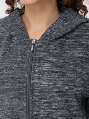 Close-up of a gray zip-up hoodie with a focus on the zipper area.