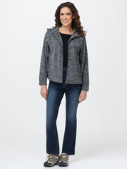 Woman wearing a gray hooded jacket and blue jeans on a white background