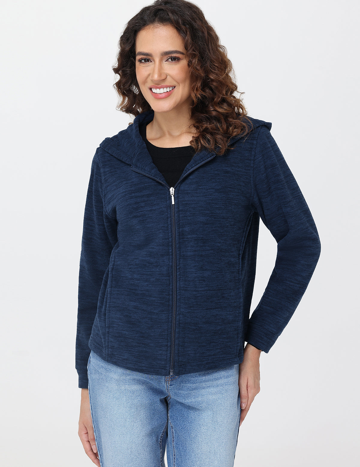 Woman wearing a blue hooded jacket on a white background