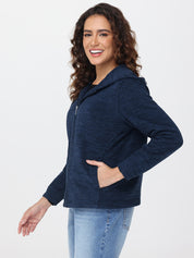 Woman wearing a navy blue jacket on a white background