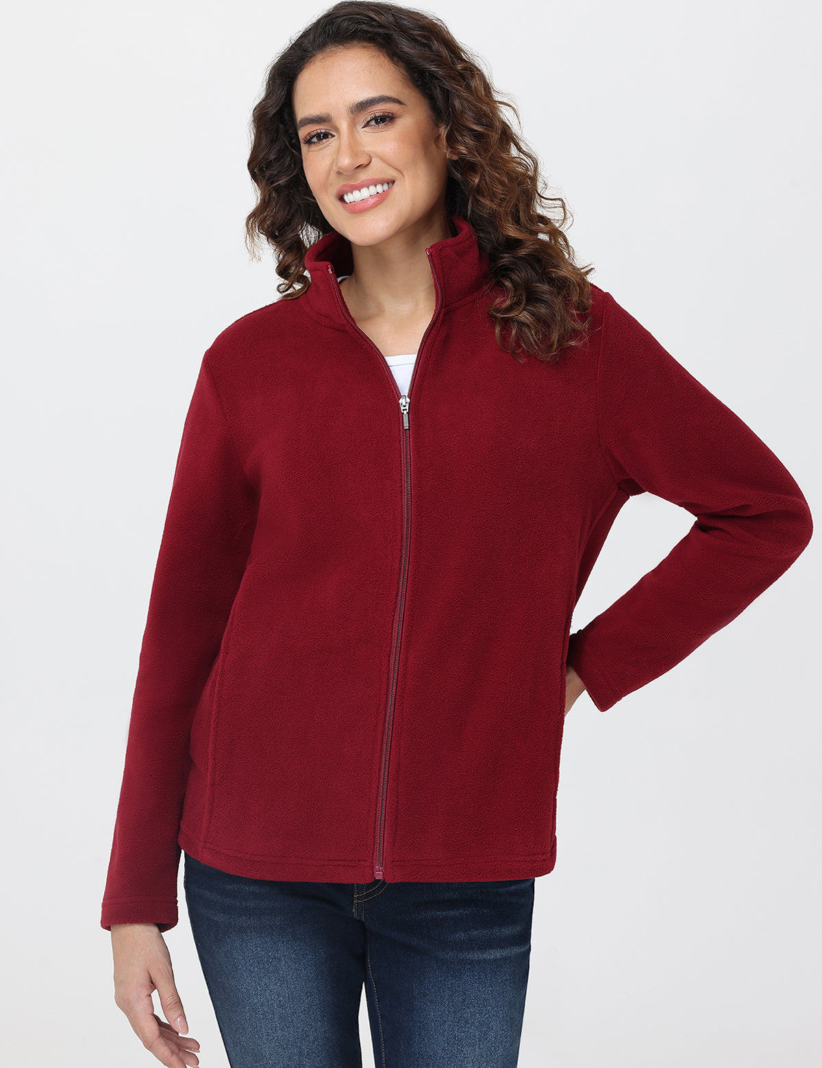 Woman wearing a red fleece jacket on a white background