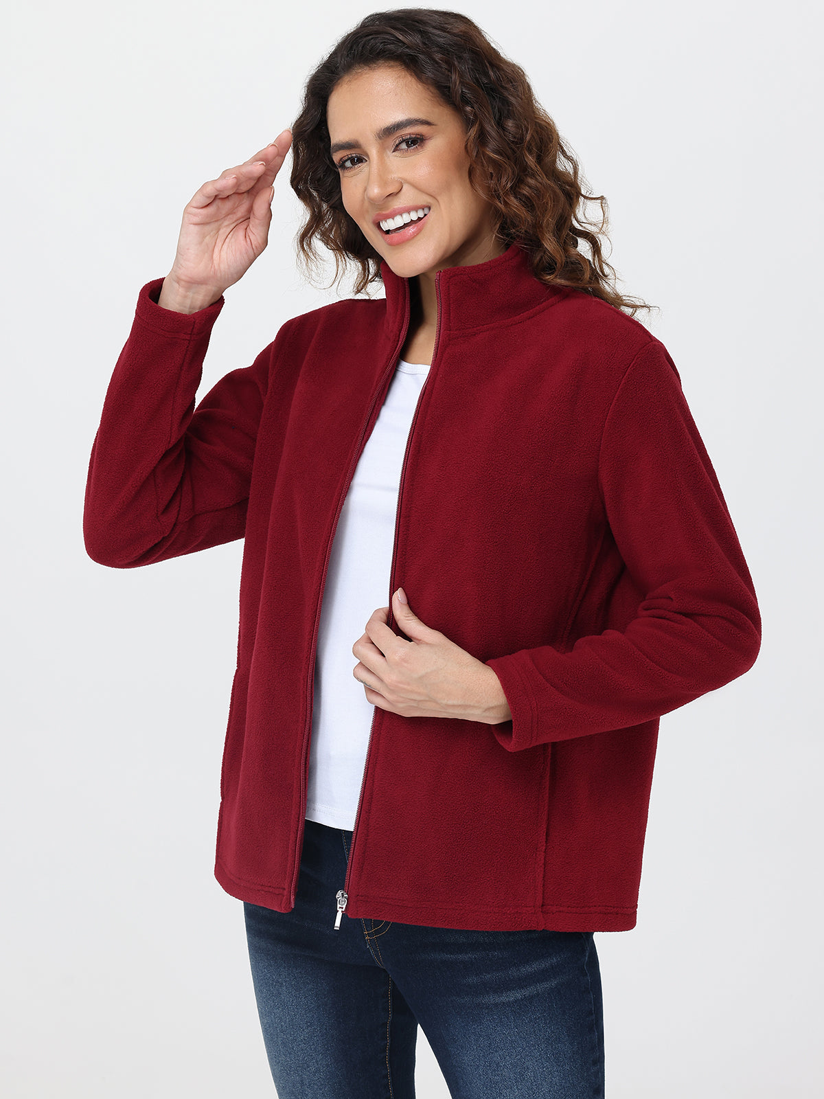 Woman wearing a red jacket on a white background