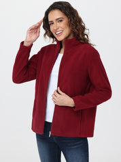 Woman wearing a red jacket on a white background