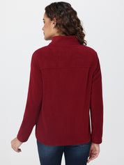 Person wearing a red fleece jacket on a white background