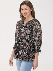 Woman wearing a floral blouse with a plain background