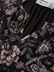 Floral patterned garment with a visible brand label on a black background