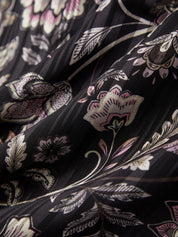 Close-up of floral patterned fabric with black background