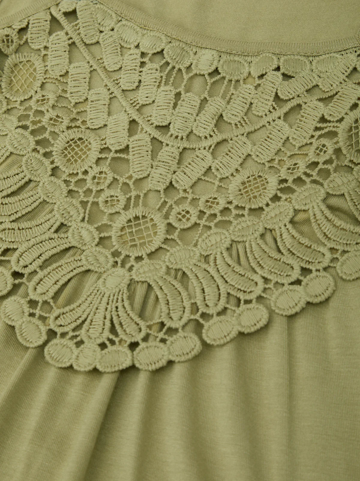 Close-up of a green lace-trimmed garment