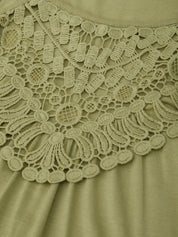 Close-up of a green lace-trimmed garment