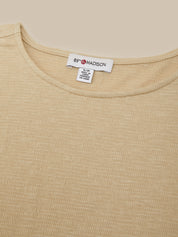 Close-up of a beige ribbed knit top showing the inner neck label which reads '89 MADISON'.