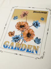 T-shirt with floral design and 'Bellflower Garden' text on a beige background