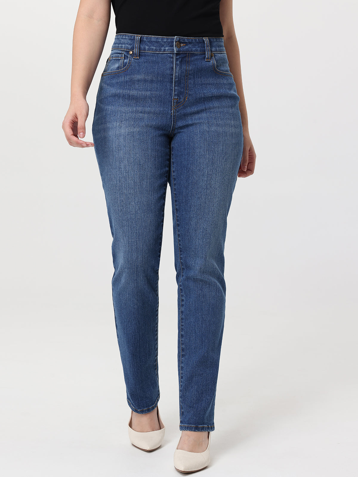 Person wearing blue jeans on a white background