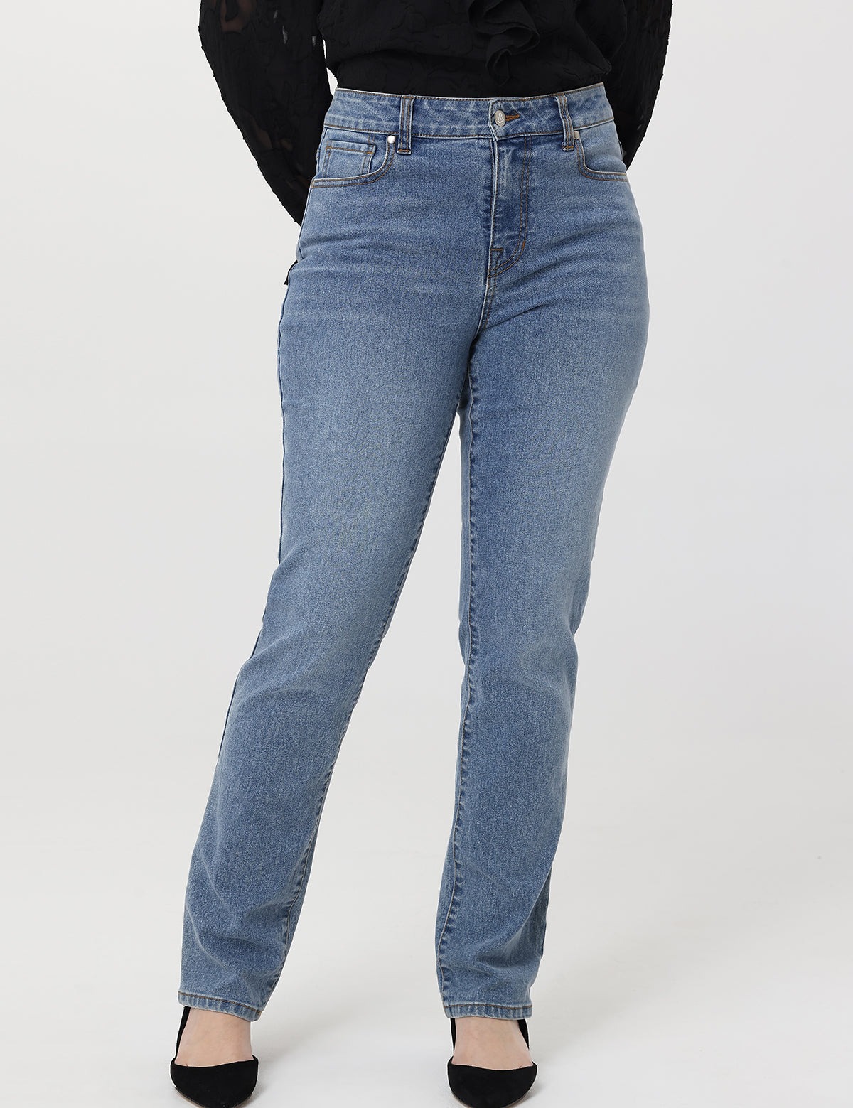 Light blue jeans worn by a person on a white background