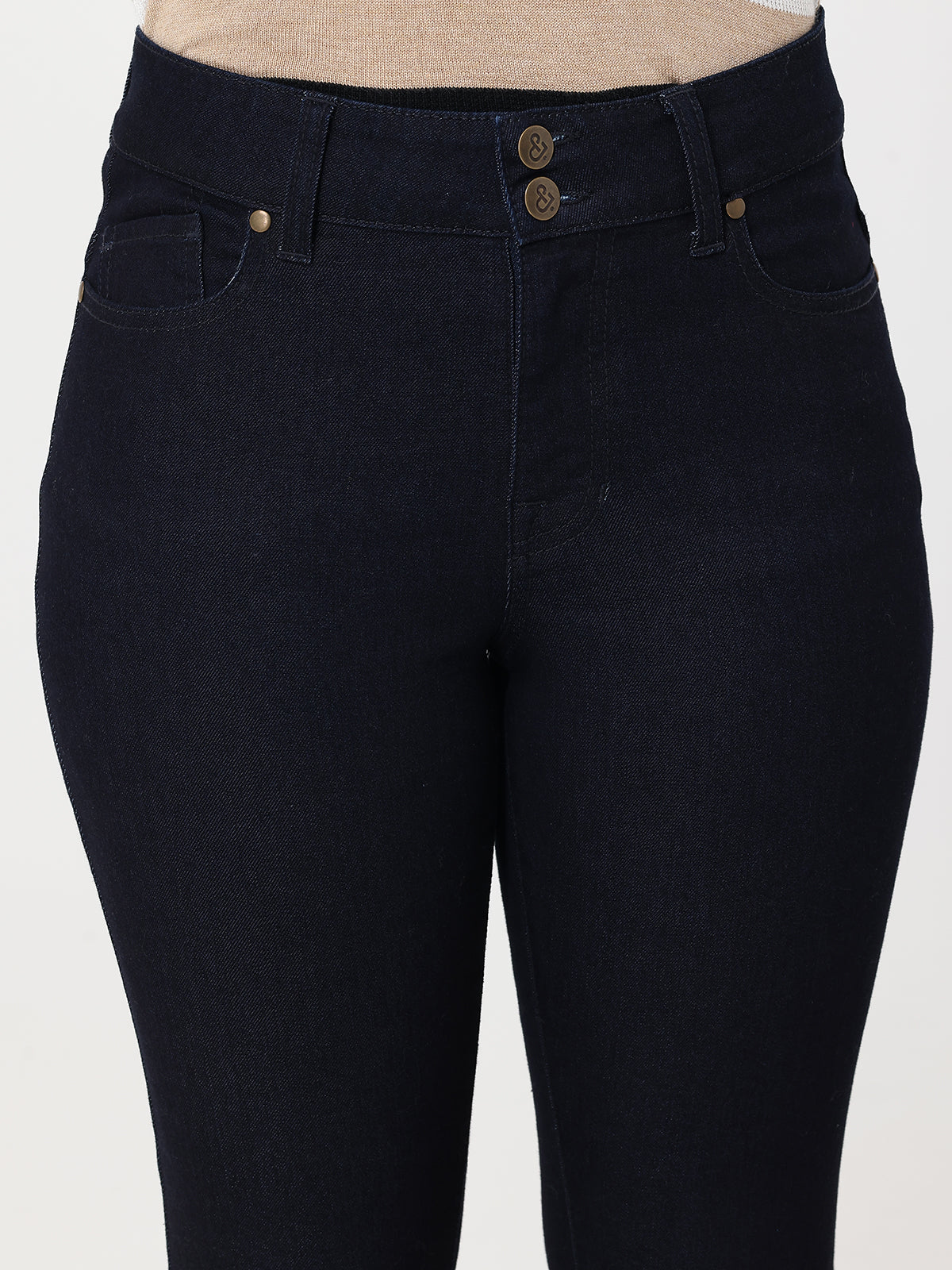 Navy jeans with gold buttons on a white background