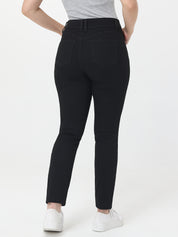 Person wearing black jeans on a white background