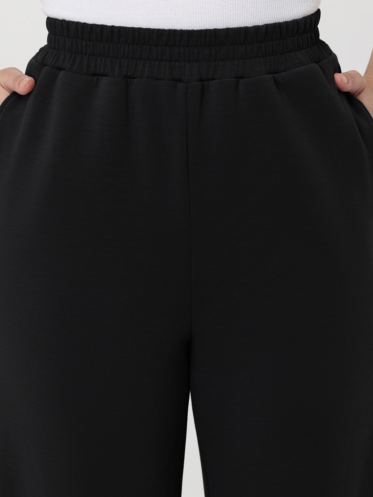 Black pants with a white background