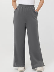 Gray wide-leg pants worn by a person on a white background