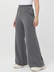Gray wide-leg pants worn by a person on a white background