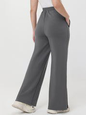 Gray wide-leg pants worn by a person on a white background