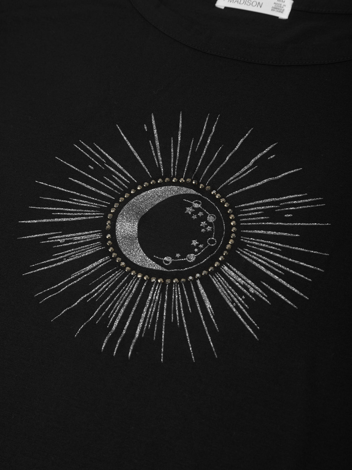 Black t-shirt with celestial design featuring a moon and sun on a plain background