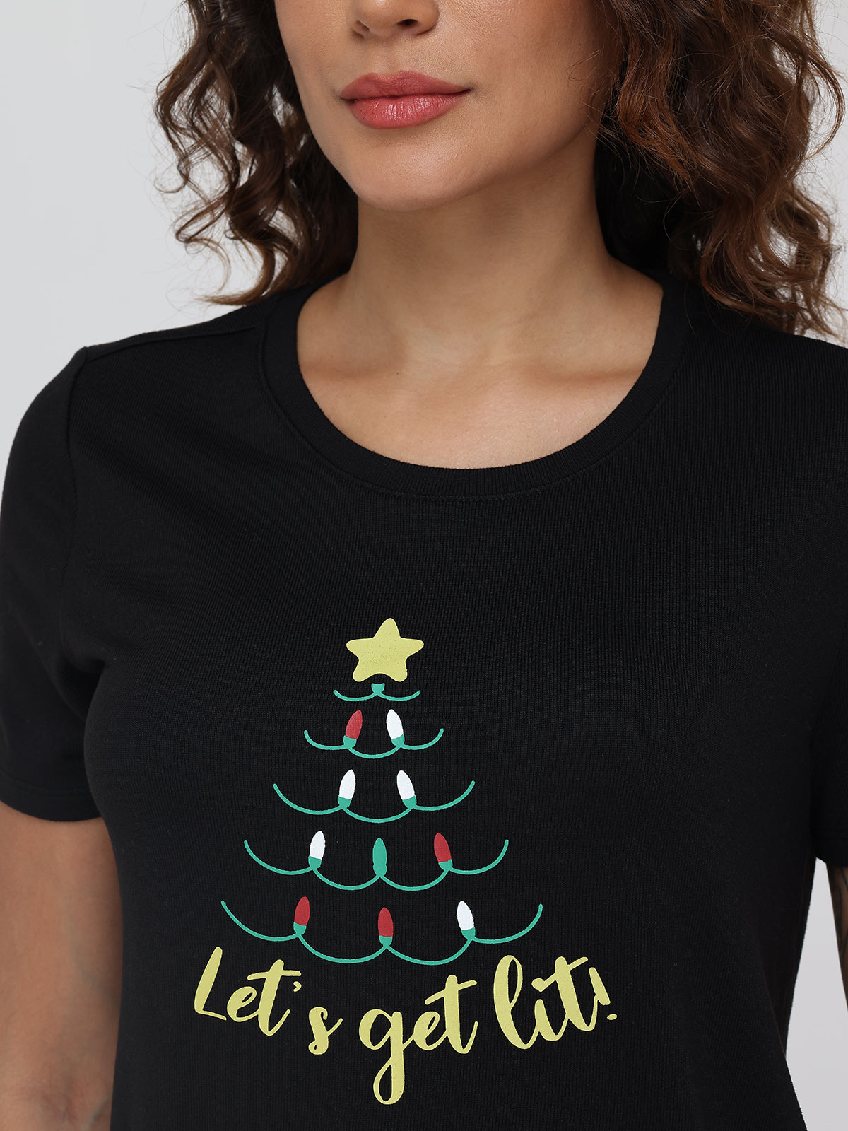 Black t-shirt with Christmas tree design and 'Let's get lit!' text on a plain background