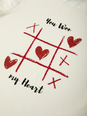 T-shirt with a tic-tac-toe design and text 'You Won My Heart' on a white background