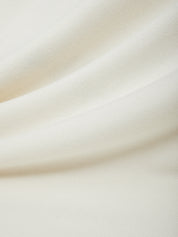 Close-up of beige fabric with a soft texture