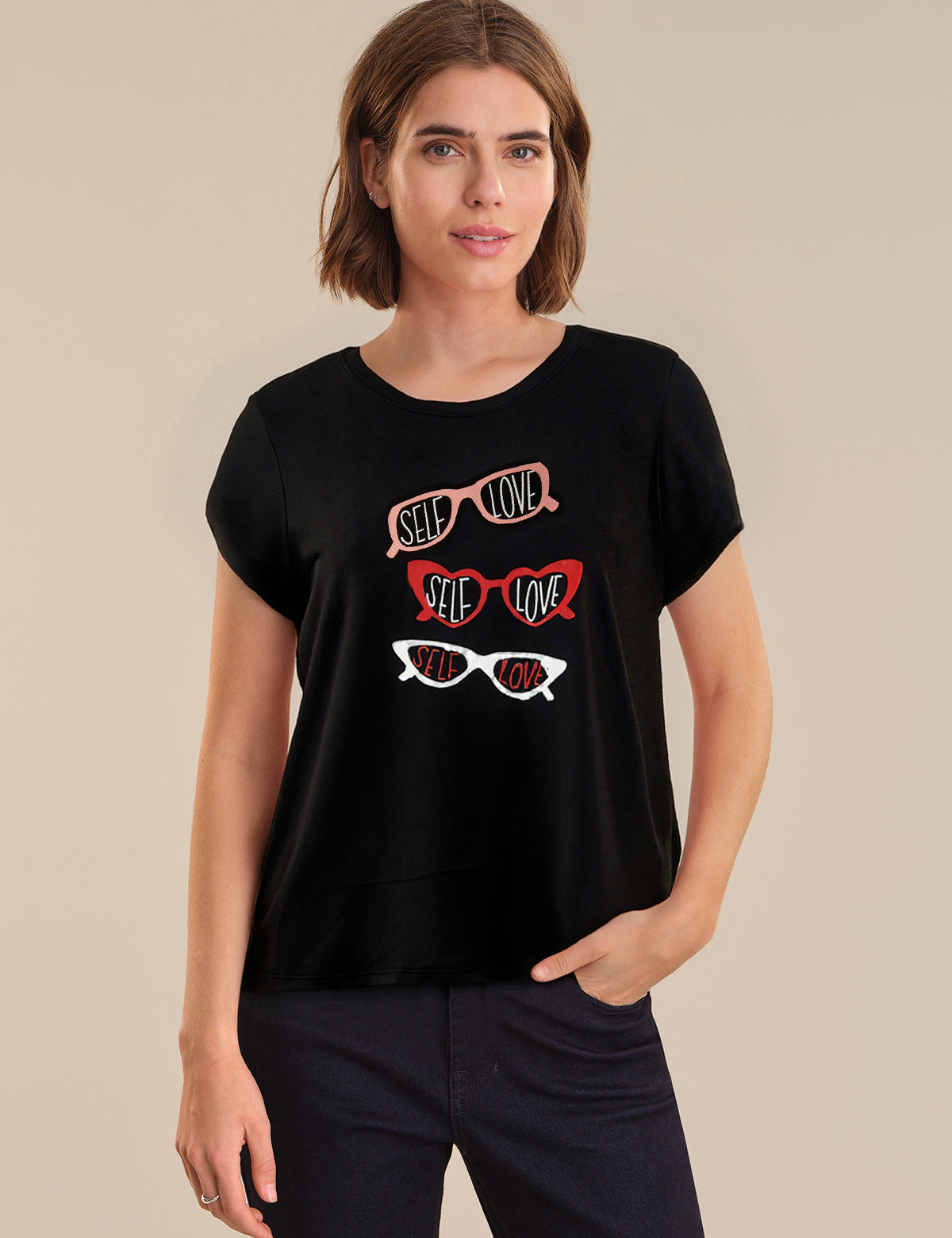 Woman wearing a black t-shirt with colorful sunglasses design on a beige background