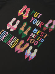 Black sweatshirt with colorful shoe illustrations and text on a black background