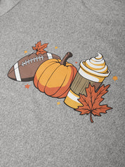A close-up of a heather gray fabric featuring a colorful autumn-themed graphic print with a football, pumpkin, soft-serve drink, and maple leaves.