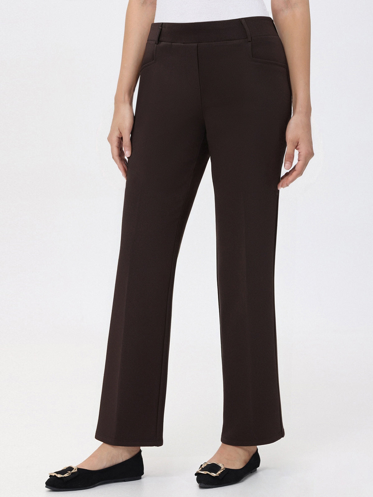 Dark brown pants worn by a person on a white background