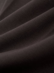 Close-up of dark brown fabric texture