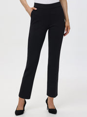 A model wearing black mid-rise front slant pocket flare pants with elastic waistband.