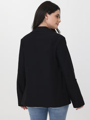 Person wearing a black blazer and blue jeans on a white background