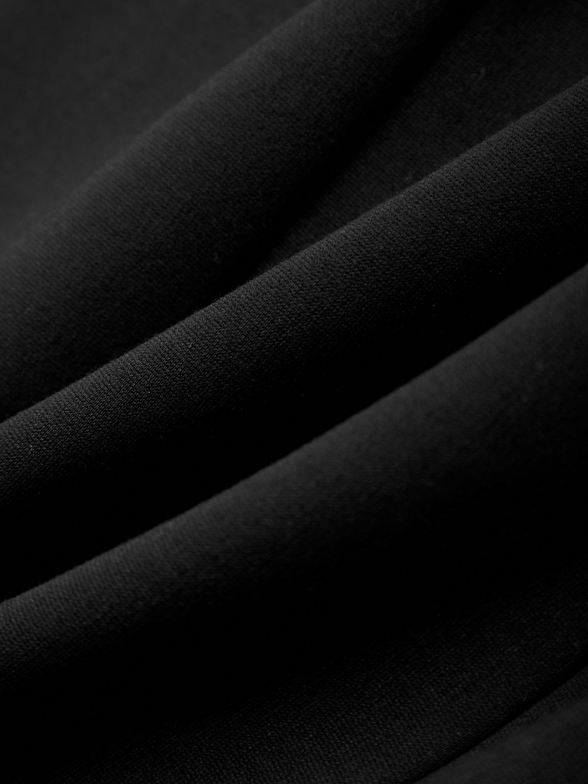 Close-up of black fabric with a textured surface