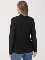 Person wearing a black blazer and blue jeans on a white background