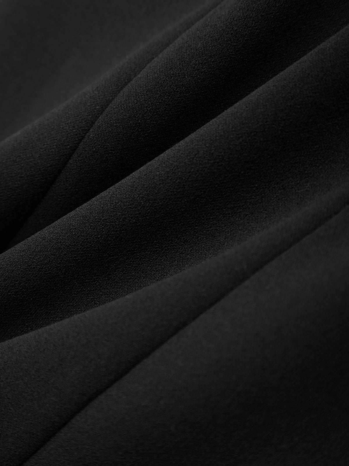 Close-up of black fabric with a textured surface