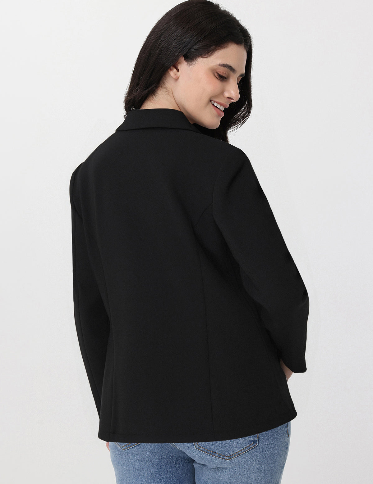 Woman wearing a black jacket on a white background