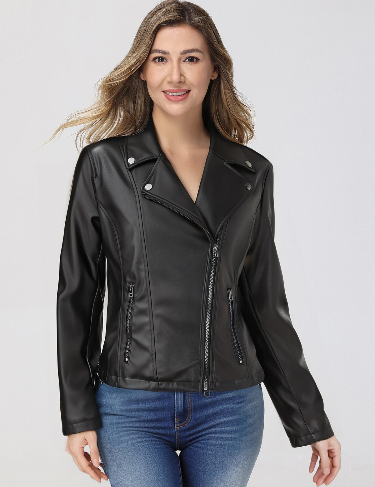 Woman wearing a black leather jacket on a white background