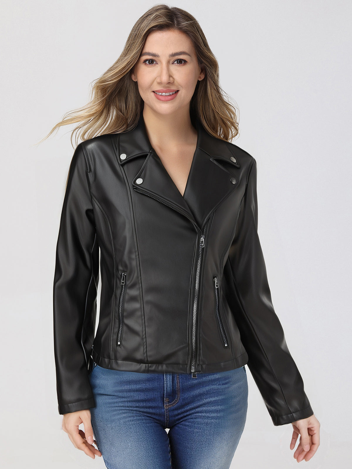 Woman wearing a black leather jacket on a white background