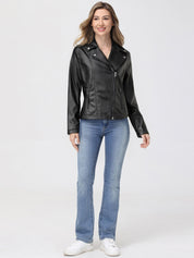 Woman wearing a black leather jacket and blue jeans on a white background