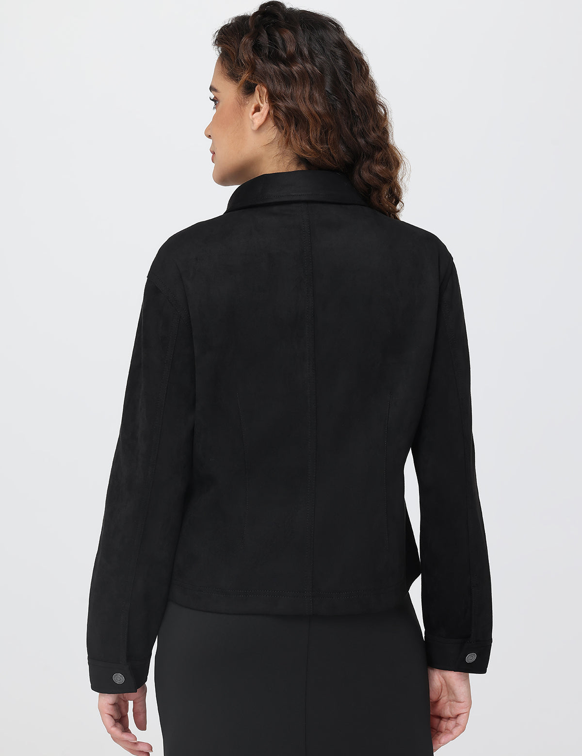 Person wearing a black jacket on a white background
