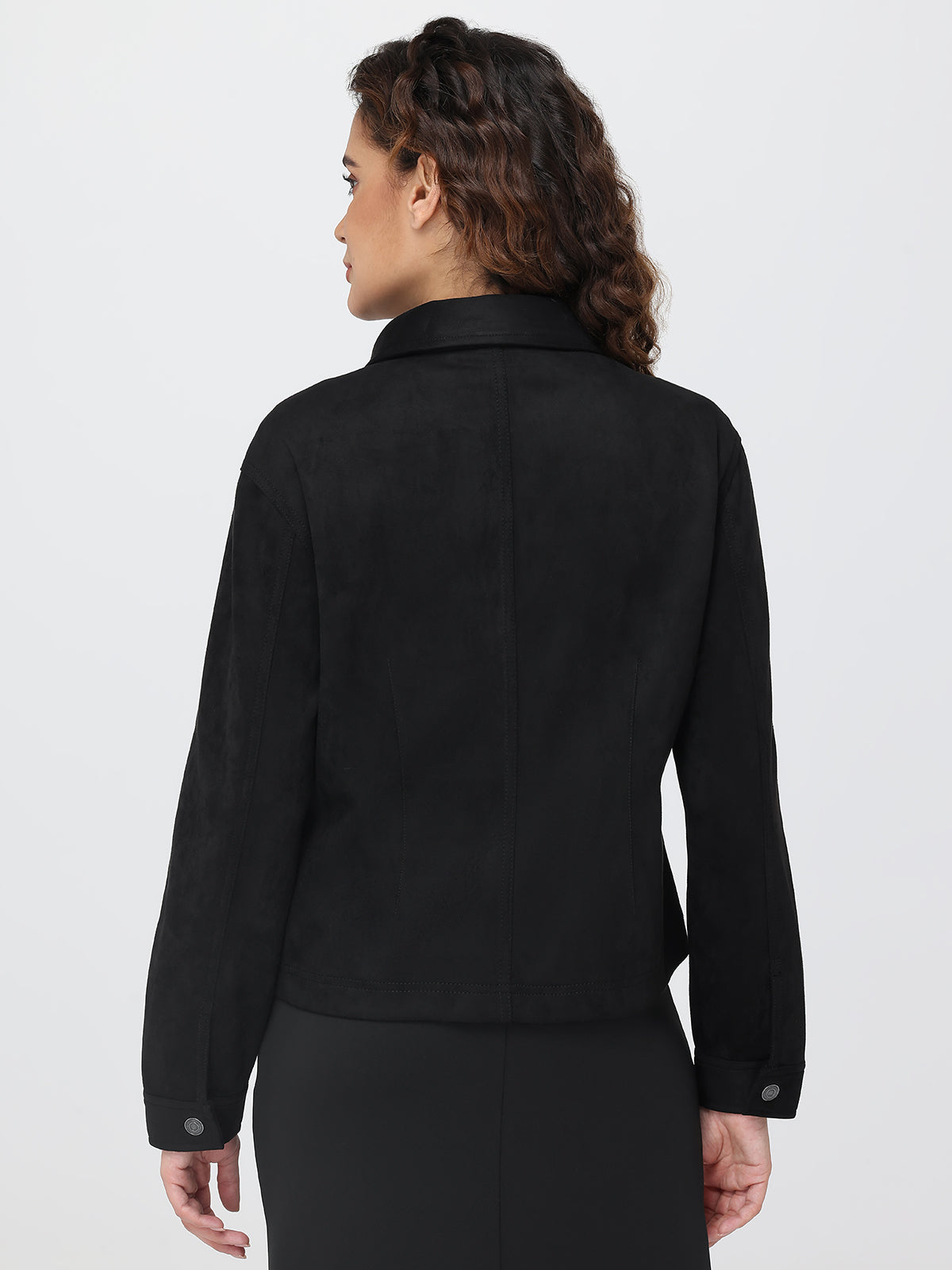 Person wearing a black jacket on a white background