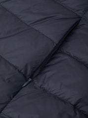 Close-up of a dark navy quilted puffer jacket showing the texture of the fabric and a black zipper detail.