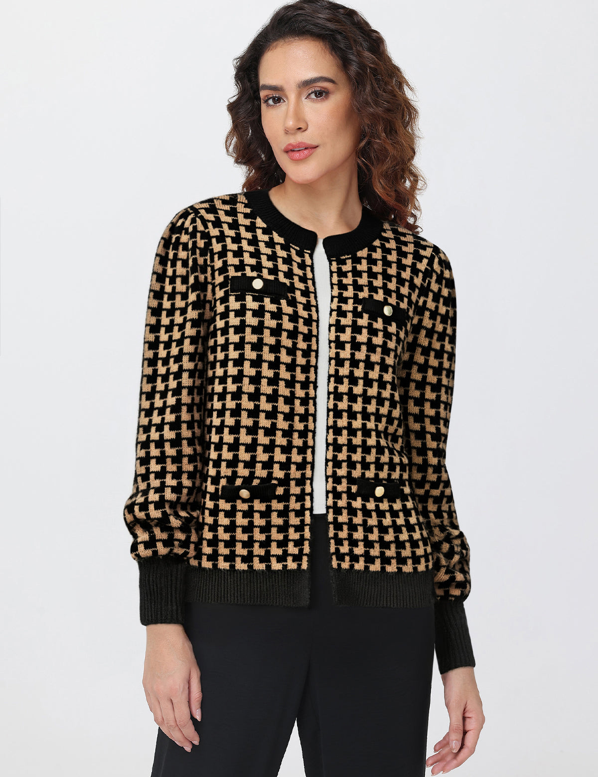Woman wearing a black and beige patterned jacket on a white background