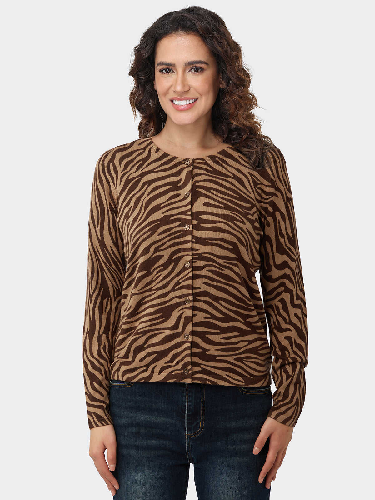 Woman wearing a brown zebra print cardigan on a white background