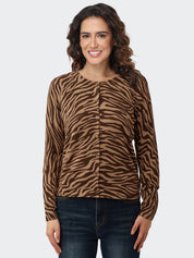 Woman wearing a brown zebra print cardigan on a white background