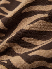 Close-up of brown fabric with black zigzag pattern