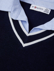 Close-up of a navy sweater with light blue collar and '89 & MADISON' label.